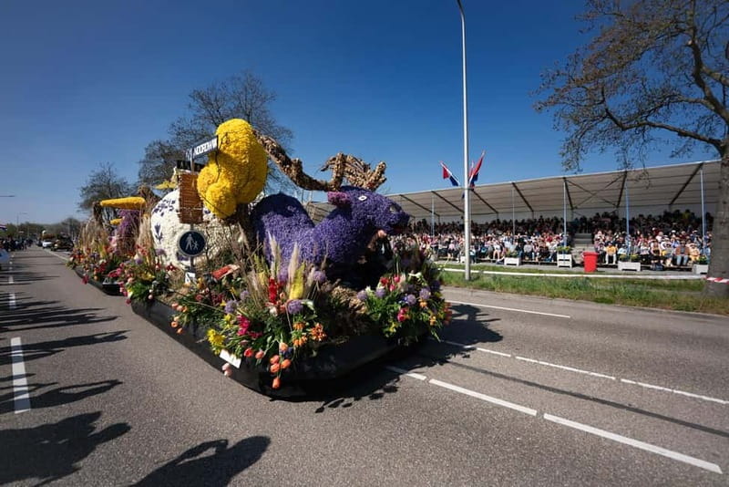 Amsterdam: Day Trip to Flower Parade & Keukenhof on April 18 - Seeing the floats up close from the grandstand
