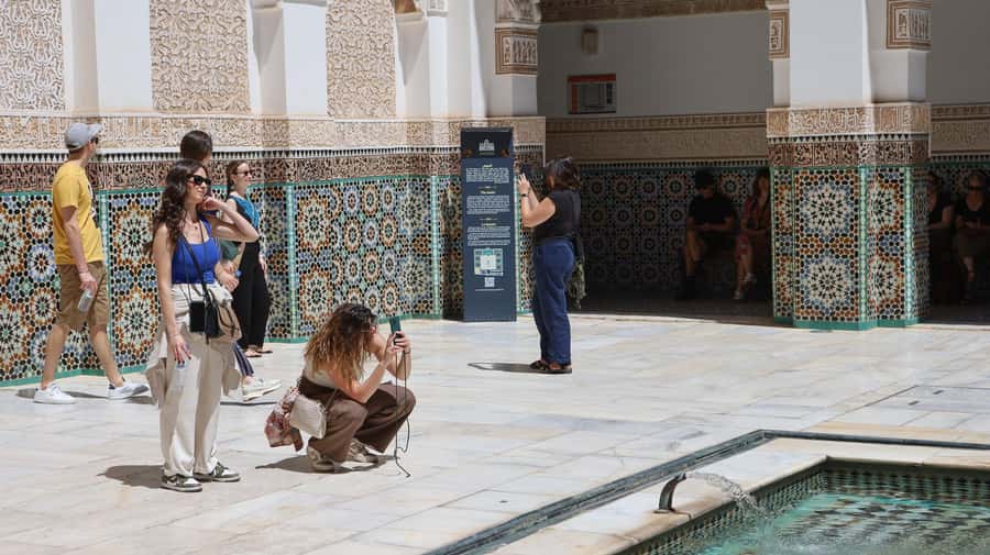 Marrakech: Madrassa Ben Youssef, Secret Garden & Medina Tour - Through Souk Semmarine and the working Medina