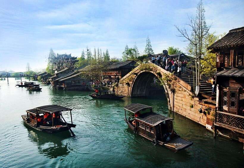 Shanghai: Zhujiajiao Private Tour w/ Boat Ride & Garden - Walking across bridges and through the old markets
